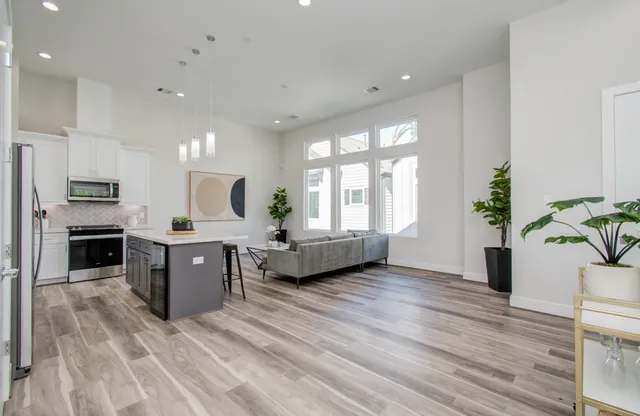 a kitchen with sink a window and appliances