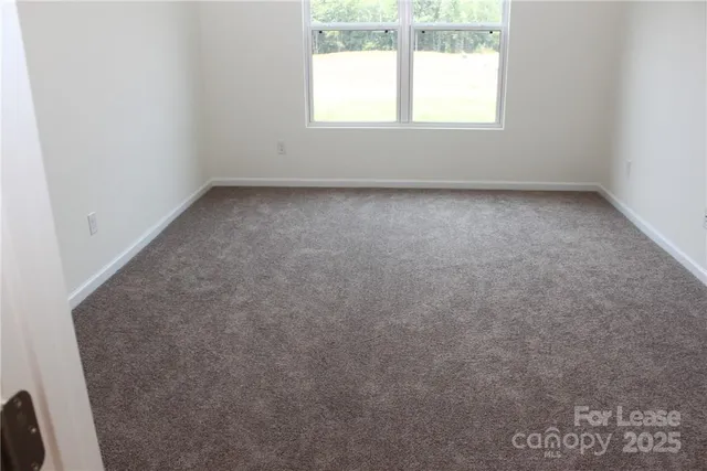 a bathroom with a toilet and a bathtub