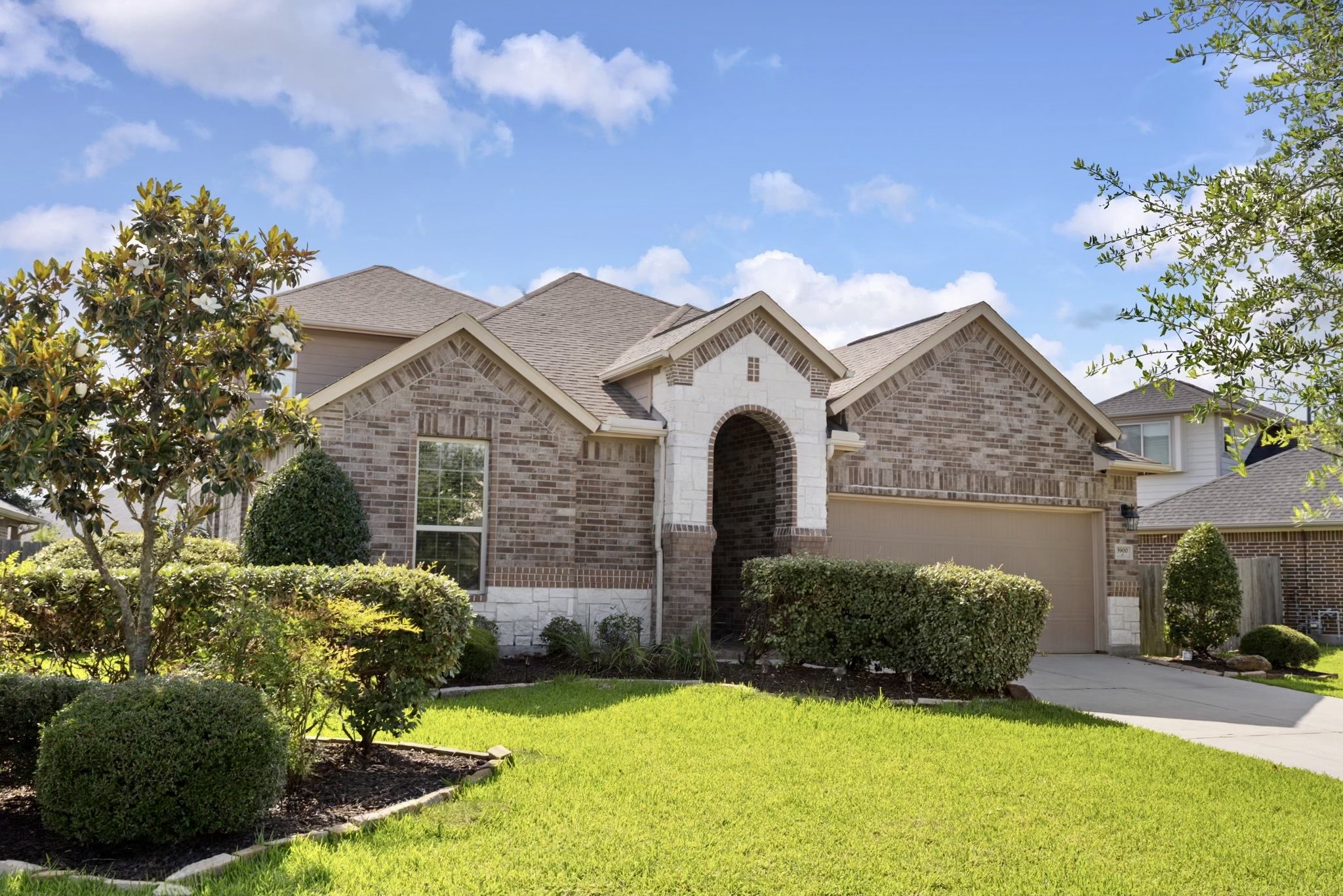 3900 Enchanted Timbers Lane Spring, TX 77386 - Photo 2 of 49 a front view of a house with yard and green space