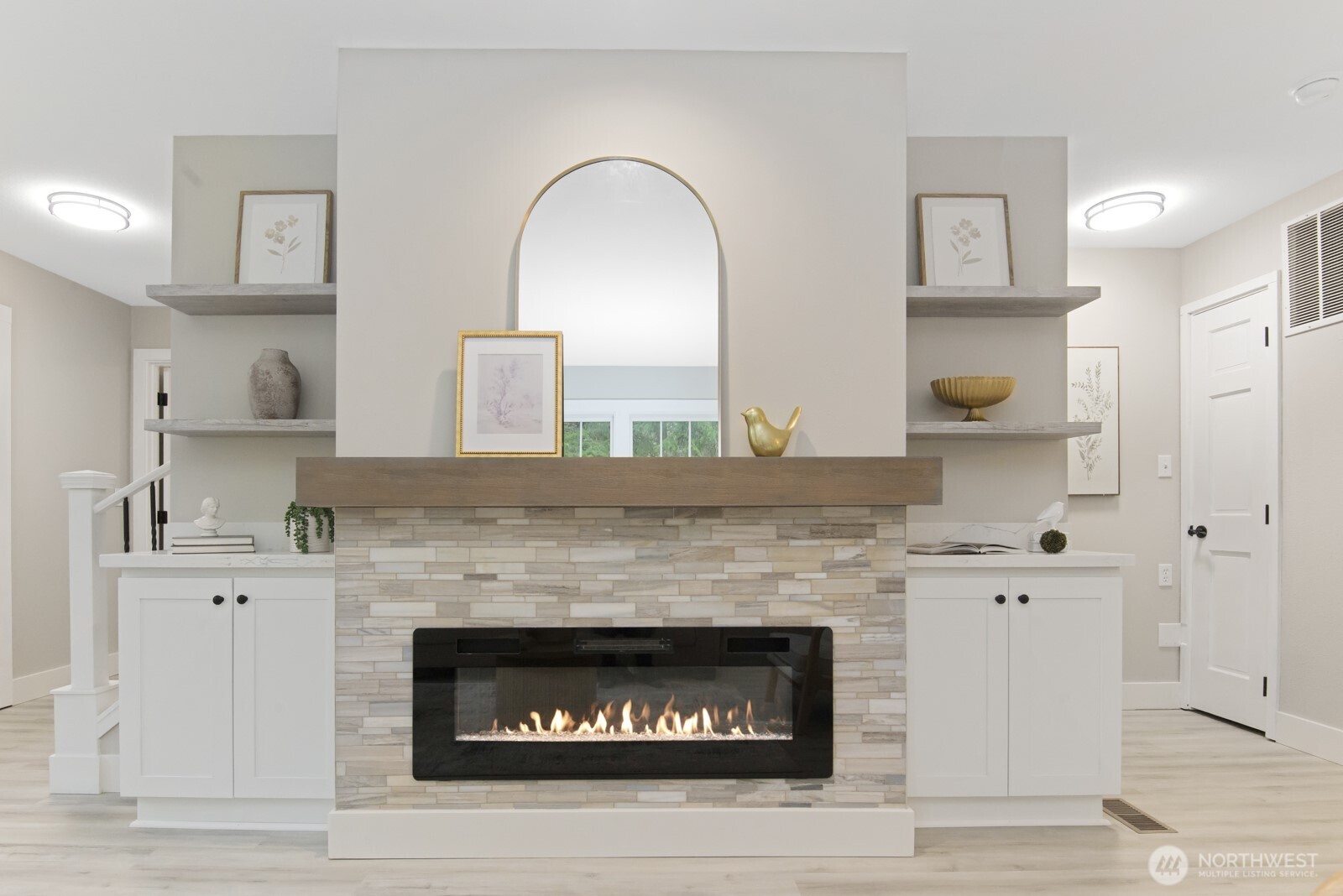 15002 Willow Road Southeast Port Orchard, WA 98367 - Photo 14 of 40 a kitchen with a fireplace and cabinets