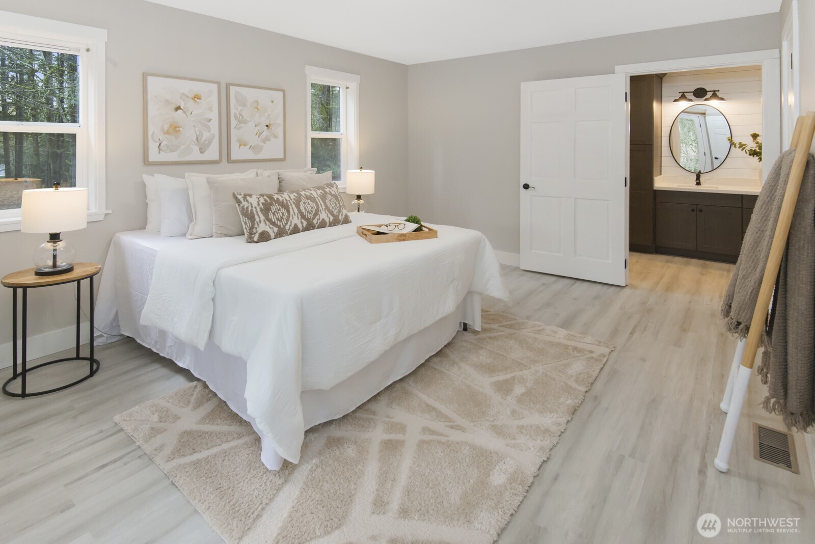 15002 Willow Road Southeast Port Orchard, WA 98367 - Photo 15 of 40 a bedroom with a bed and a painting on the wall