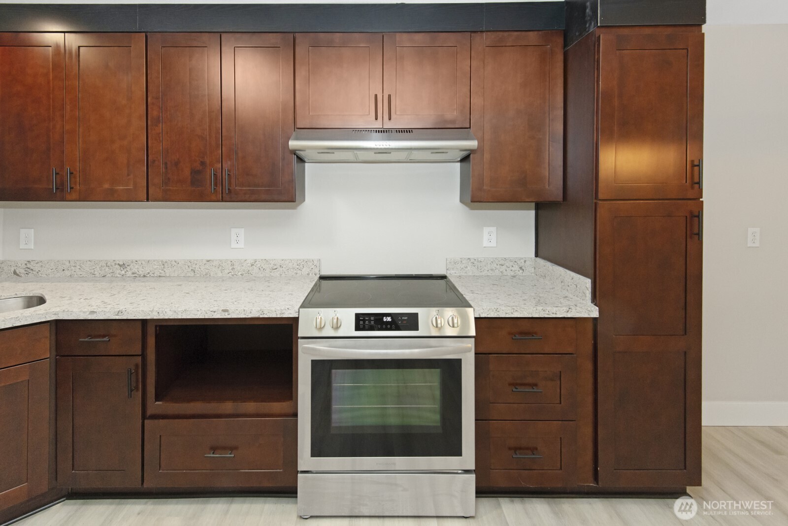 15002 Willow Road Southeast Port Orchard, WA 98367 - Photo 27 of 40 a kitchen with granite countertop wood cabinets and stainless steel appliances