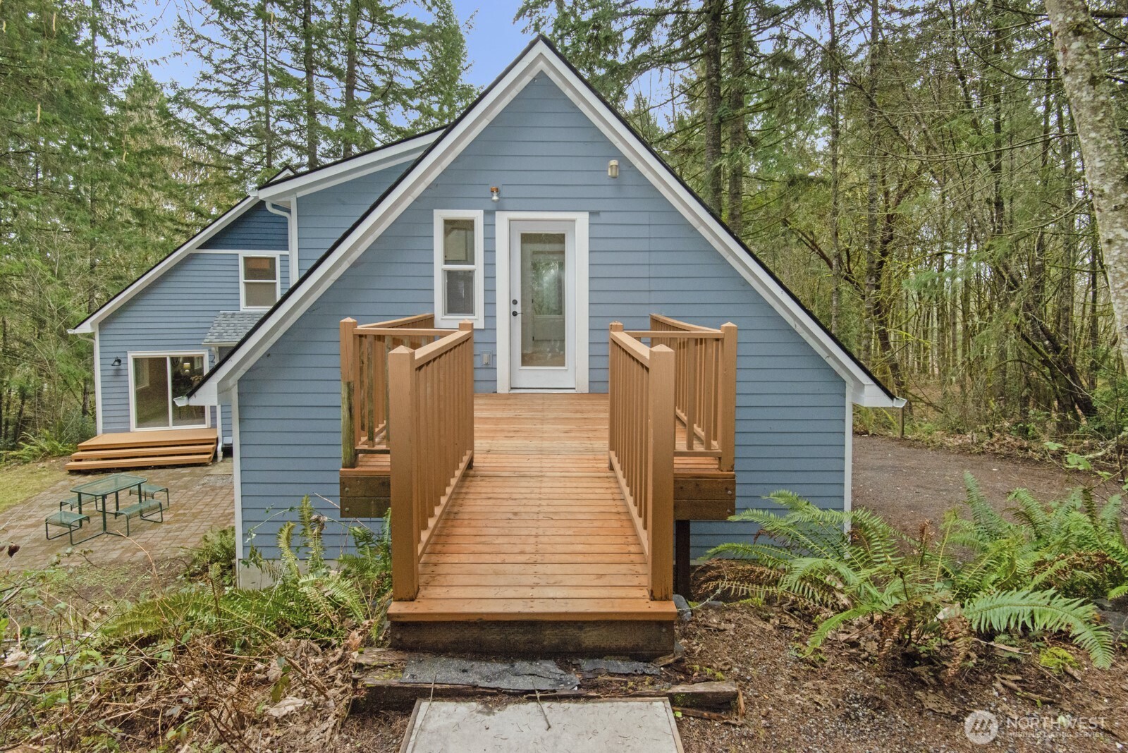 15002 Willow Road Southeast Port Orchard, WA 98367 - Photo 31 of 40 a view of a house with a yard
