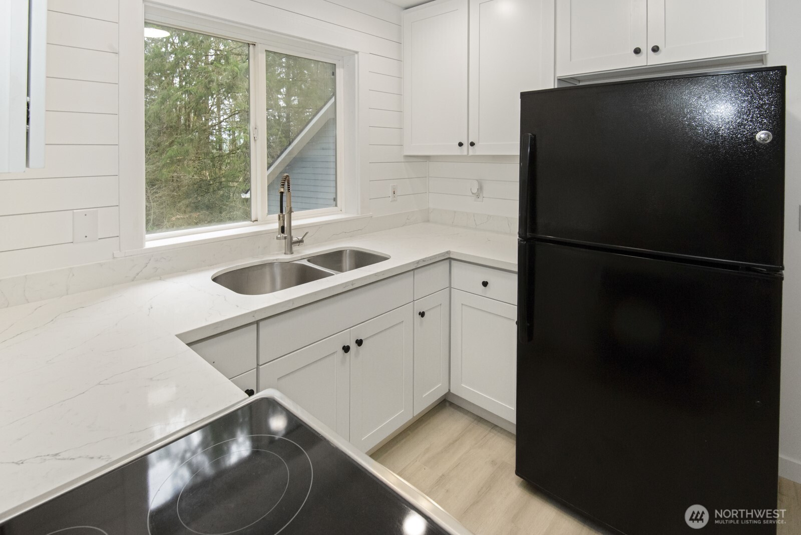 15002 Willow Road Southeast Port Orchard, WA 98367 - Photo 33 of 40 a kitchen with a refrigerator and a sink