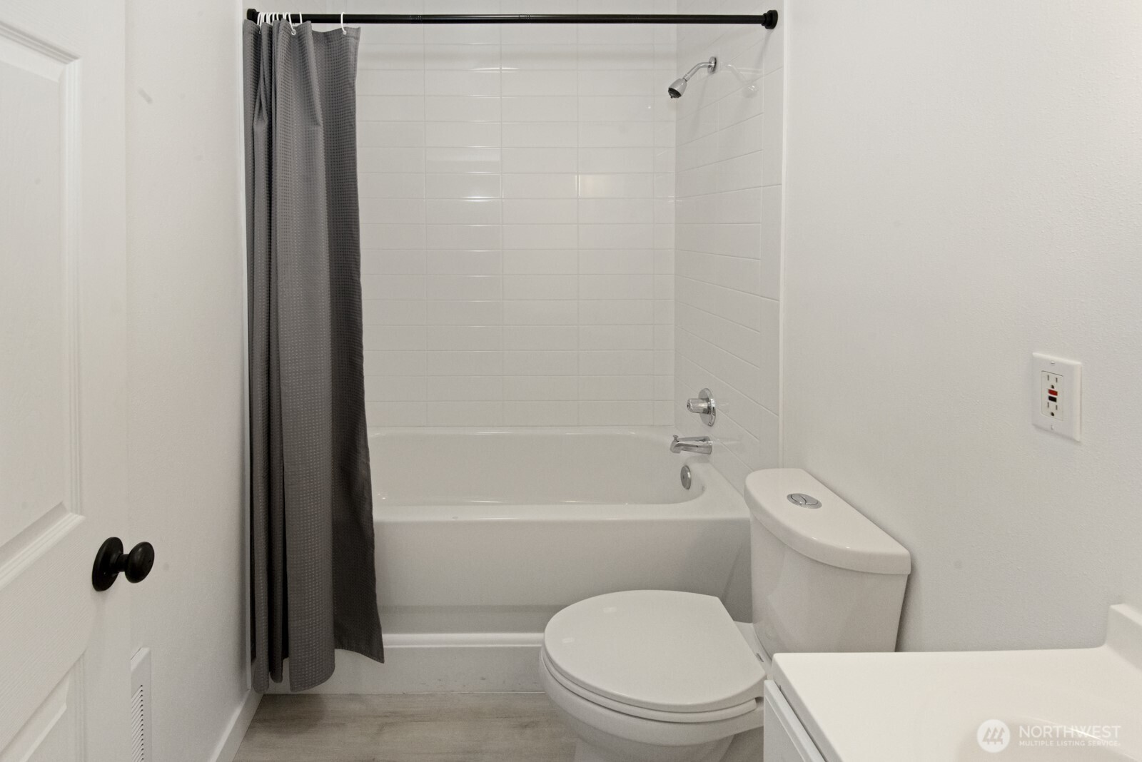 15002 Willow Road Southeast Port Orchard, WA 98367 - Photo 35 of 40 a white toilet sitting next to a bathroom sink