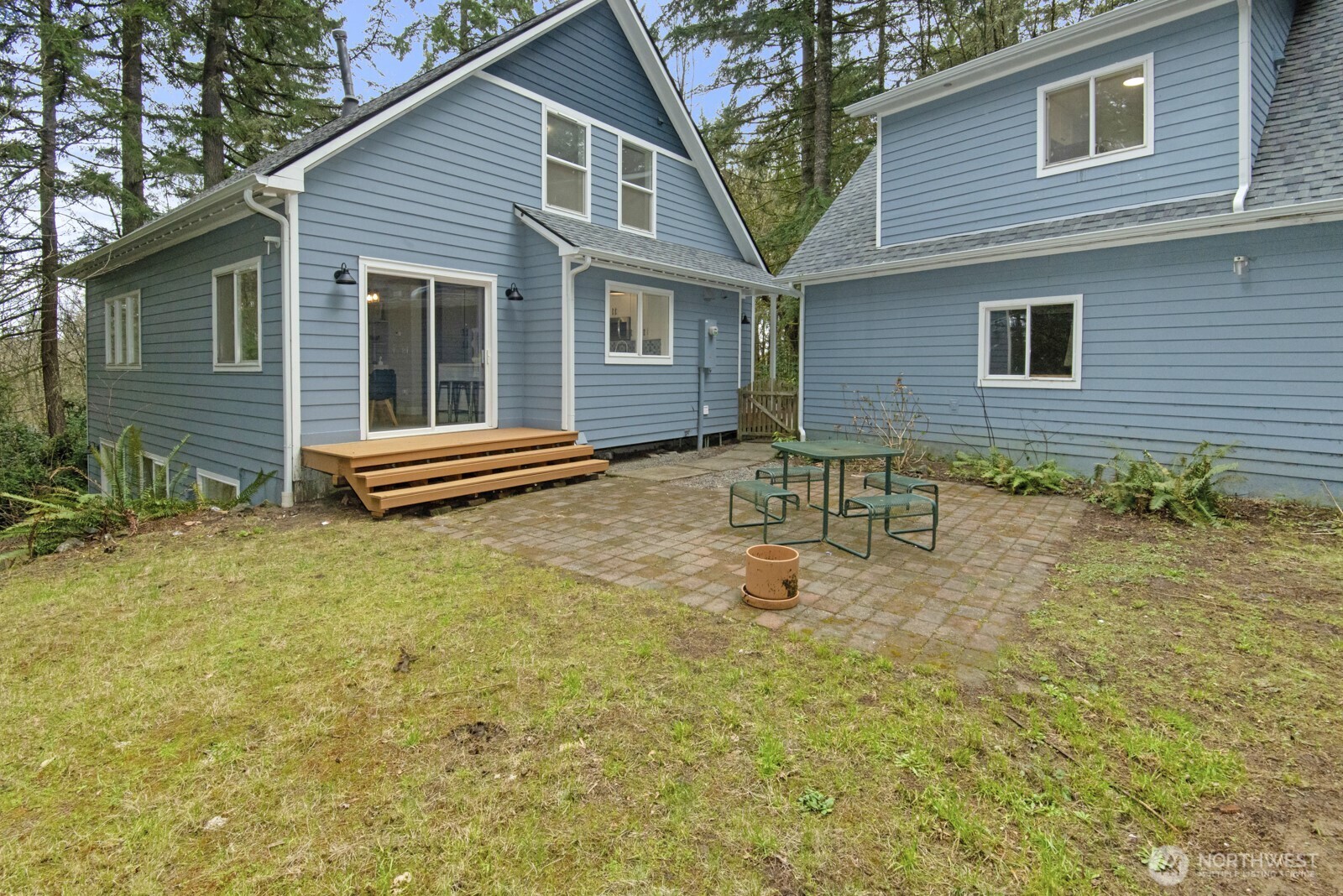 15002 Willow Road Southeast Port Orchard, WA 98367 - Photo 37 of 40 a backyard of a house with table and chairs