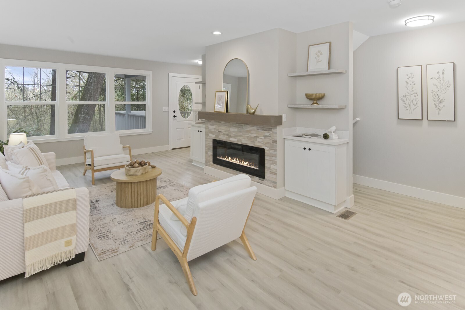 15002 Willow Road Southeast Port Orchard, WA 98367 - Photo 4 of 40 a living room with furniture and a fireplace