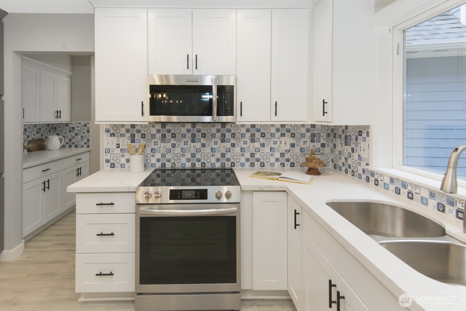 15002 Willow Road Southeast Port Orchard, WA 98367 - Photo 6 of 40 a view of a kitchen with sink and washing machine