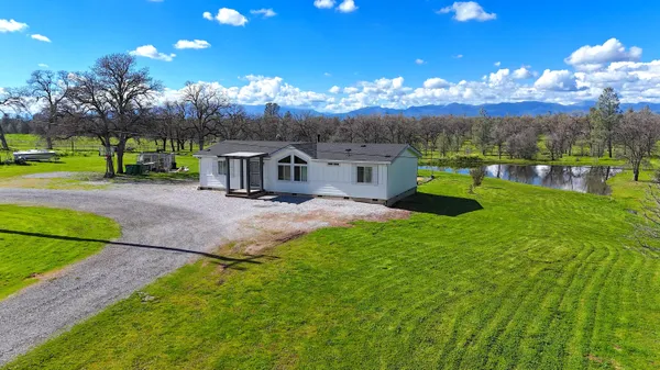 a view of a house with a big yard