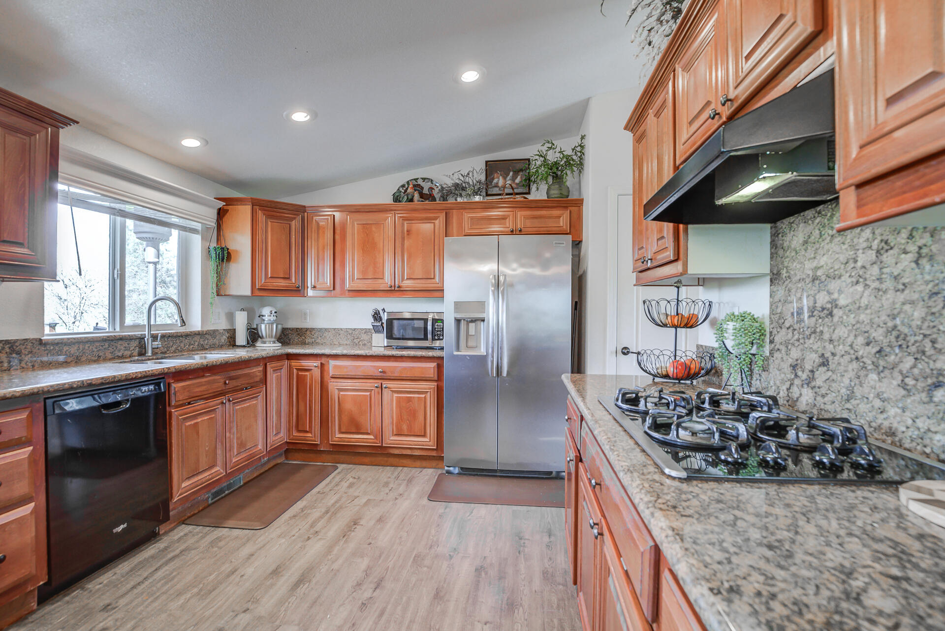 11636 Homestead Lane Redding, CA 96003 - Photo 11 of 37 a kitchen with stainless steel appliances granite countertop a stove a sink dishwasher and a refrigerator