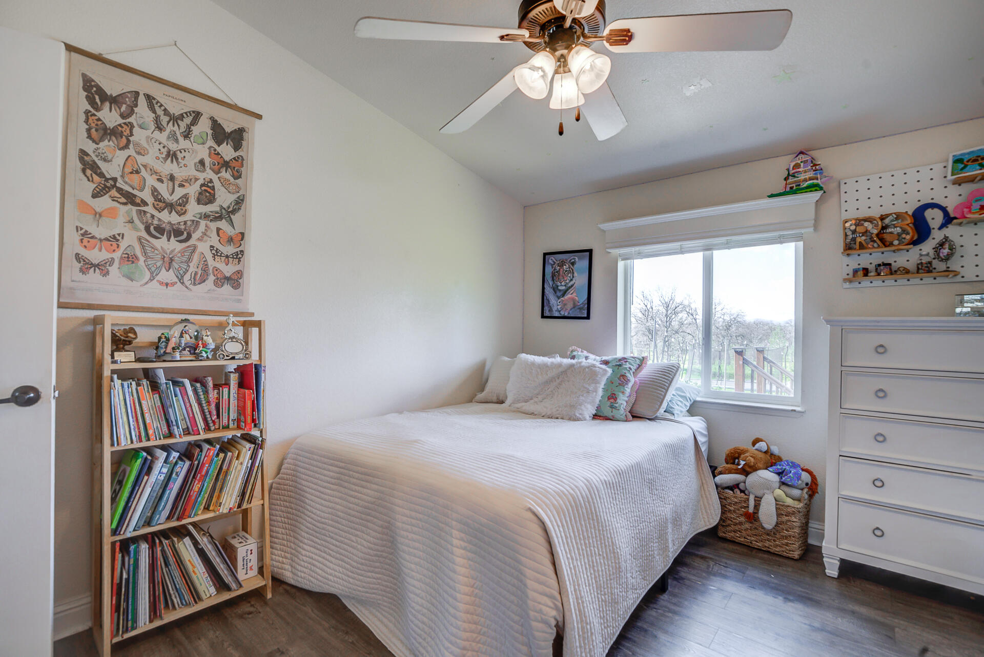 11636 Homestead Lane Redding, CA 96003 - Photo 19 of 37 a bedroom with a bed and a book shelf