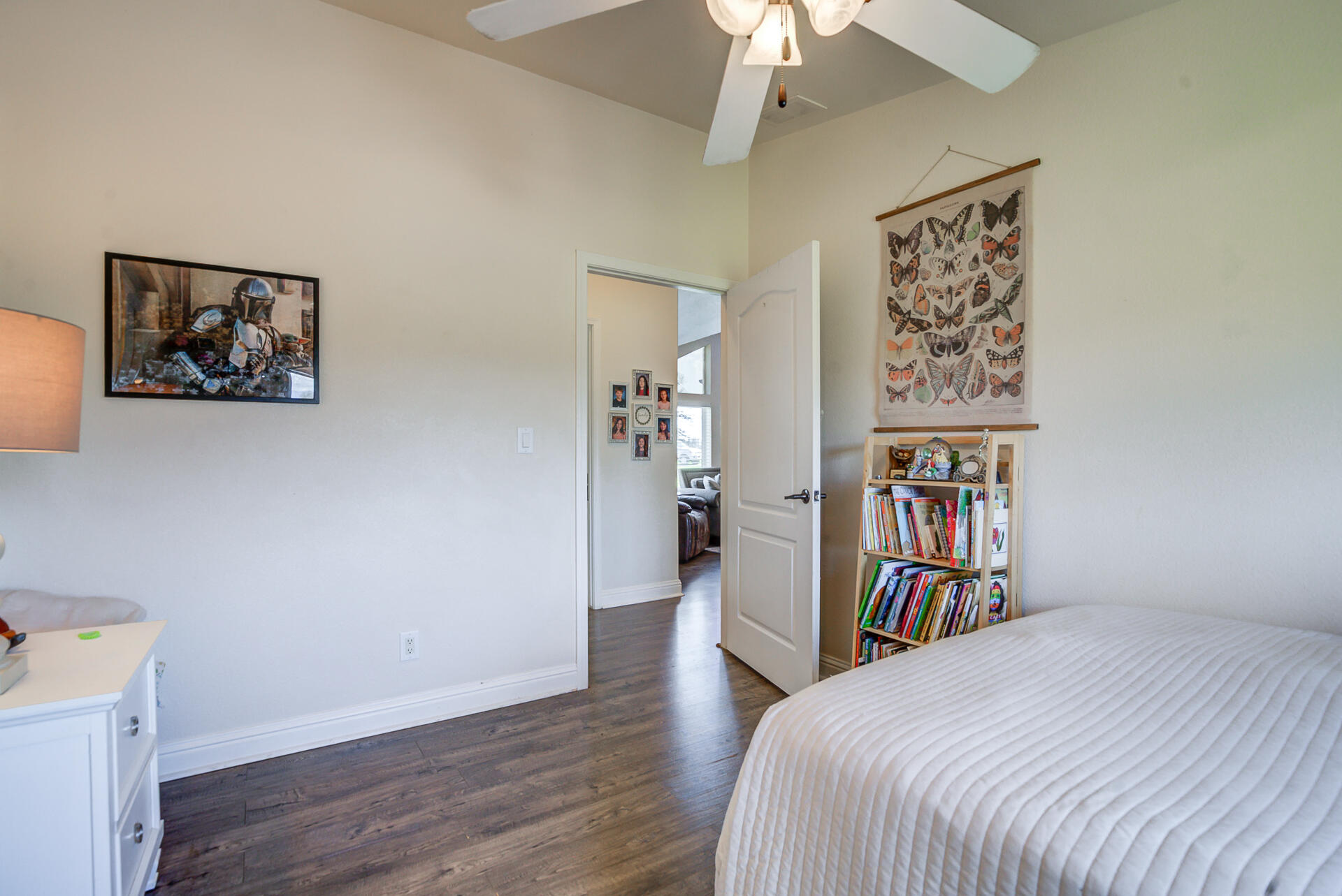 11636 Homestead Lane Redding, CA 96003 - Photo 20 of 37 a bedroom with a bed and a book shelf