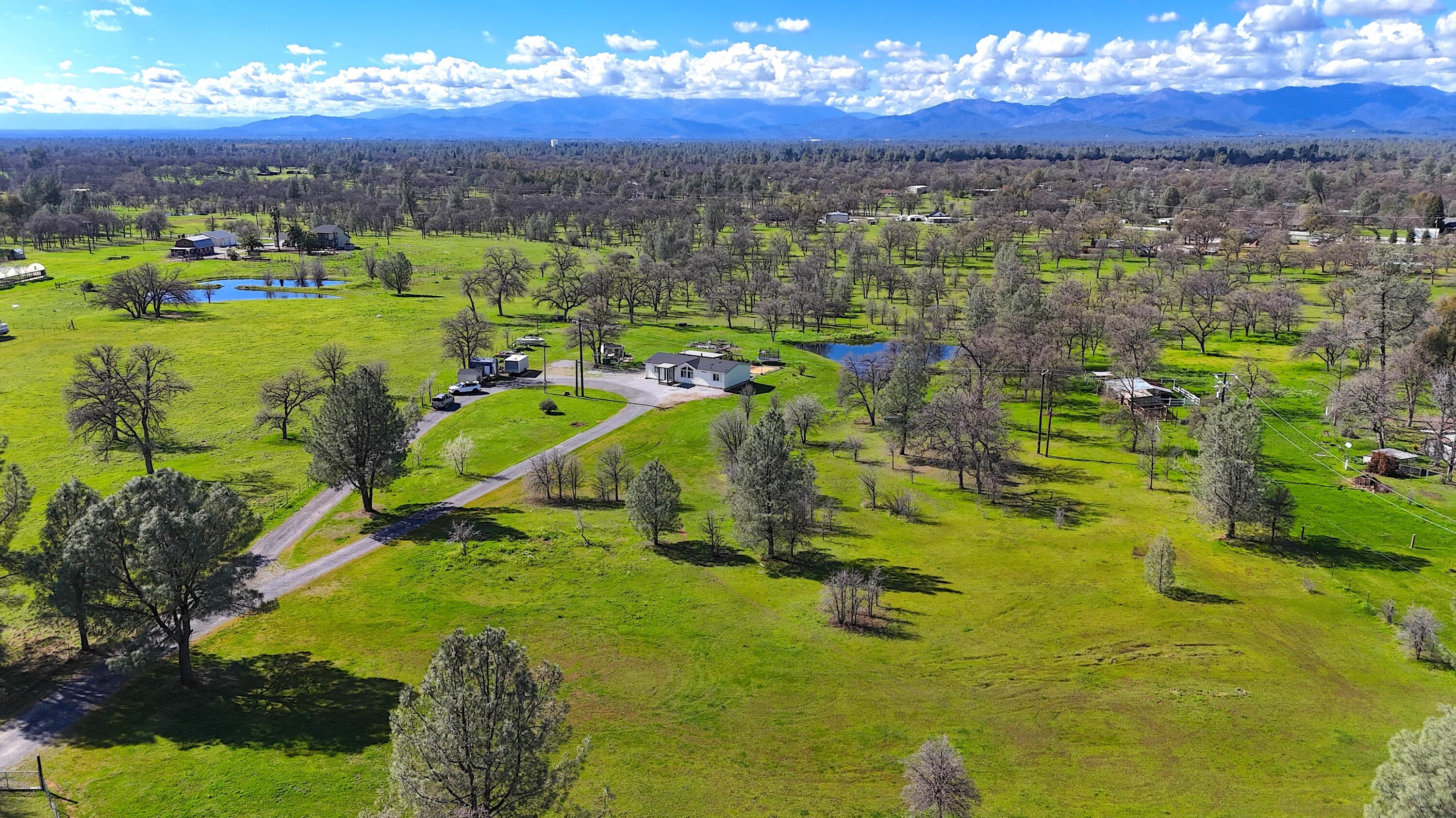 11636 Homestead Lane Redding, CA 96003 - Photo 26 of 37 a view of a city with lots of residential buildings ocean and mountain view