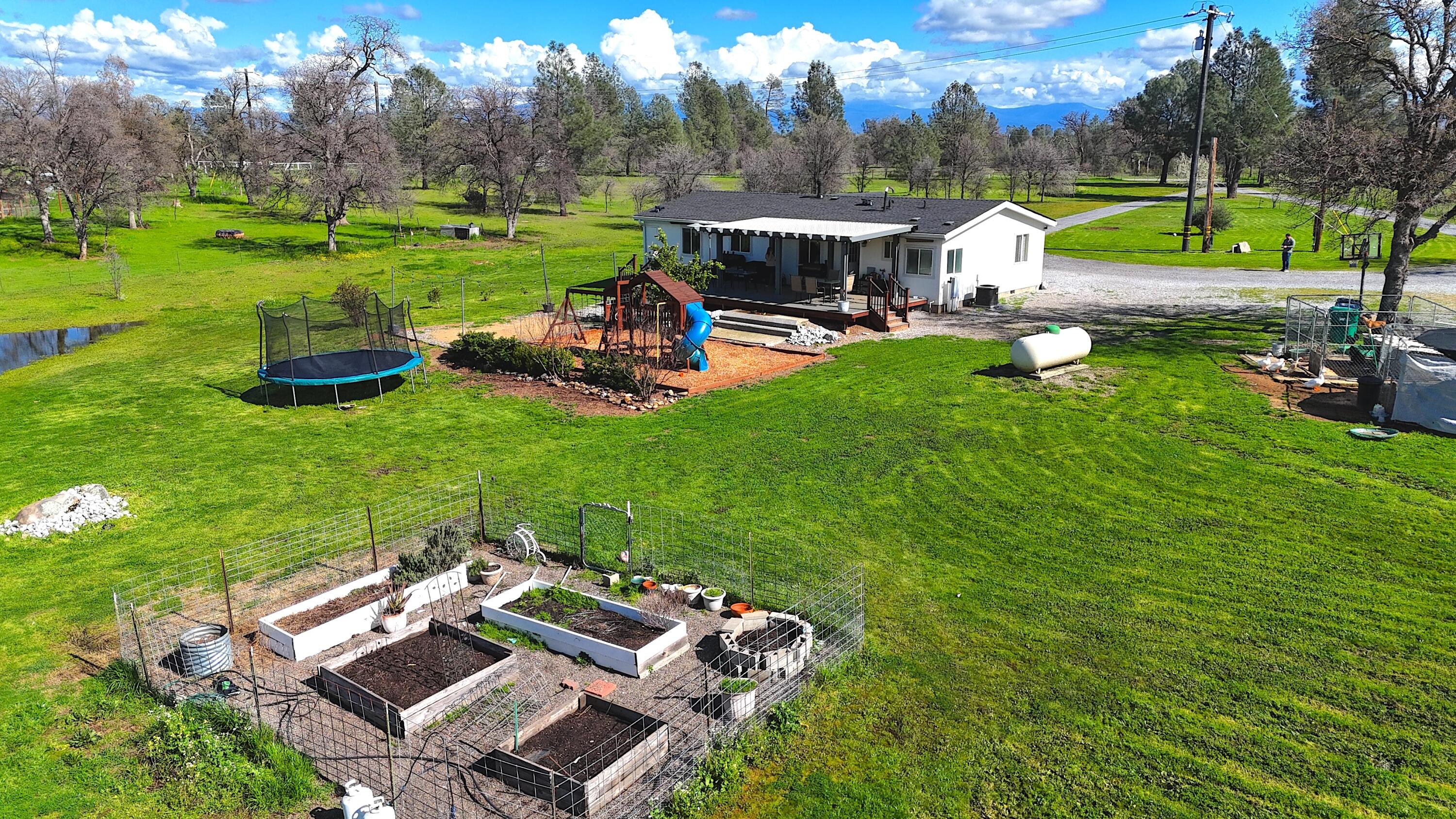 11636 Homestead Lane Redding, CA 96003 - Photo 29 of 37 a view of a house with a yard