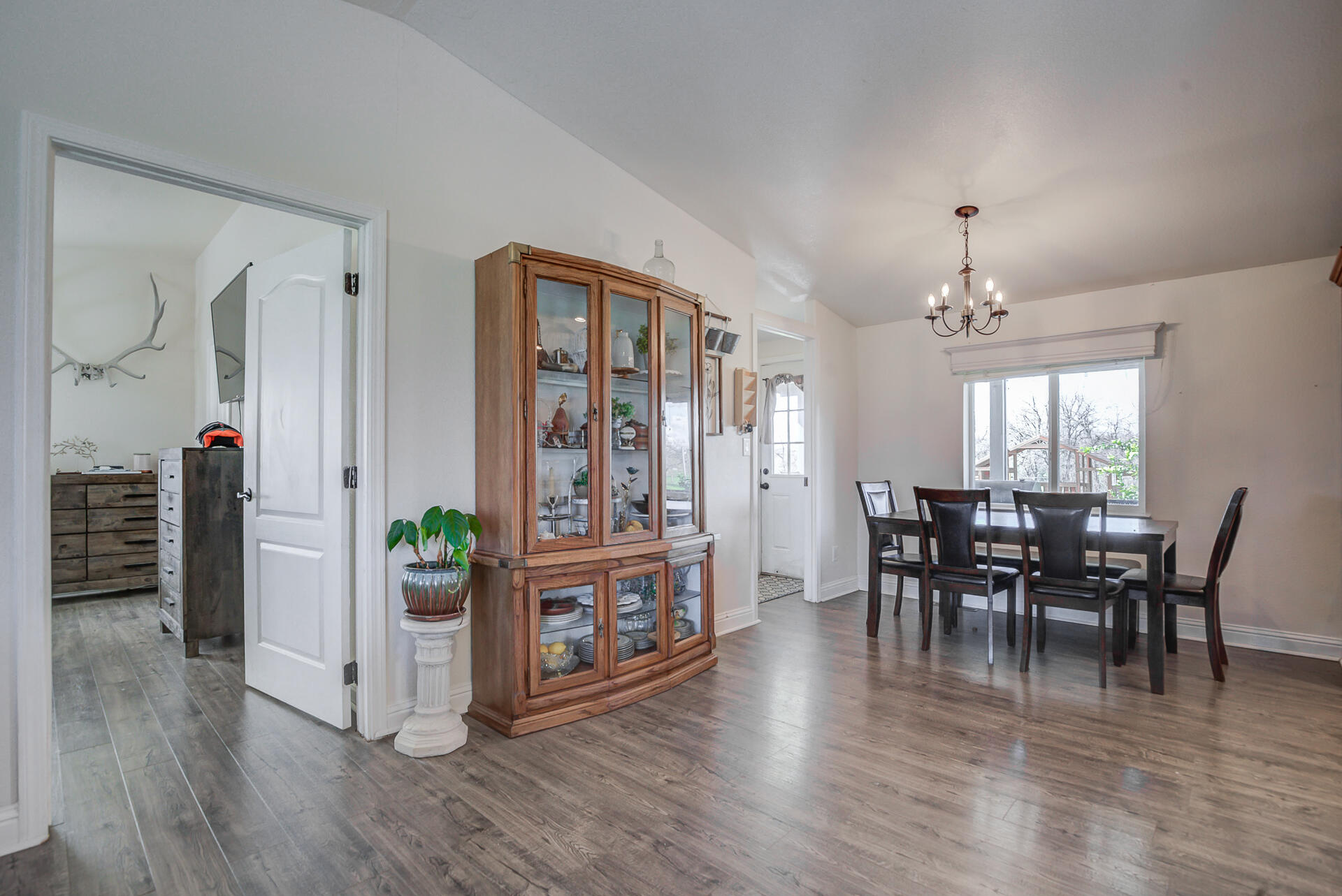 11636 Homestead Lane Redding, CA 96003 - Photo 7 of 37 a view of a dining room with furniture and wooden floor