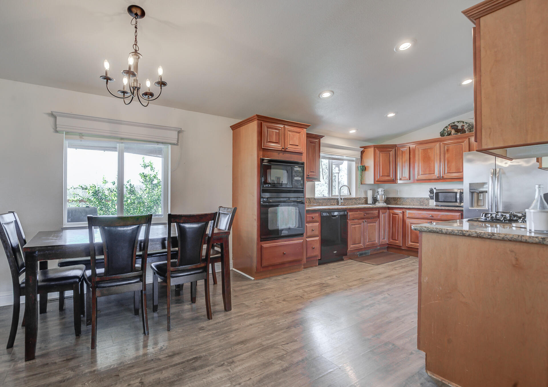 11636 Homestead Lane Redding, CA 96003 - Photo 8 of 37 a view of a dining room with furniture window and wooden floor