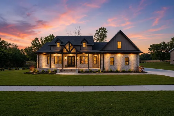 a front view of a house with a yard