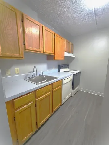 a utility room with sink dryer and washer