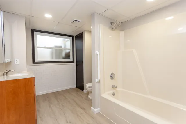 a bathroom with a bathtub and a shower