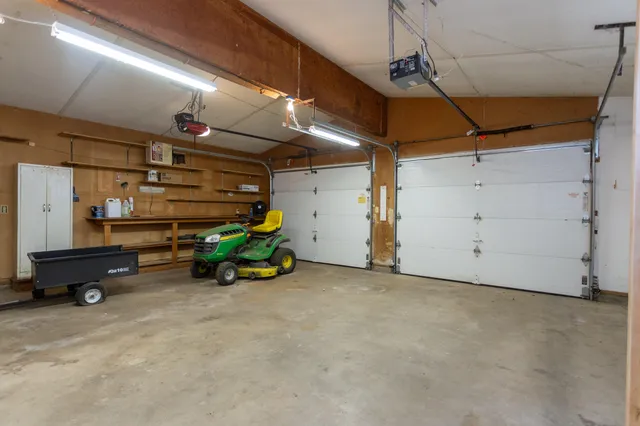 a view of a garage with parked cars