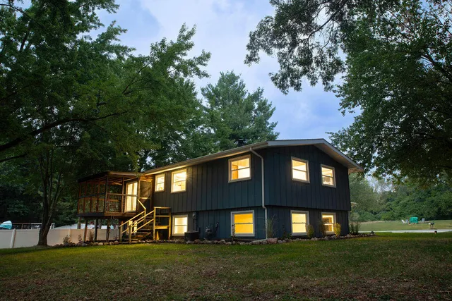 a front view of a house with a yard
