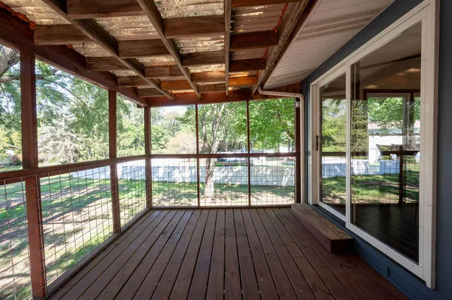 a view of room with wooden floor outdoor seating
