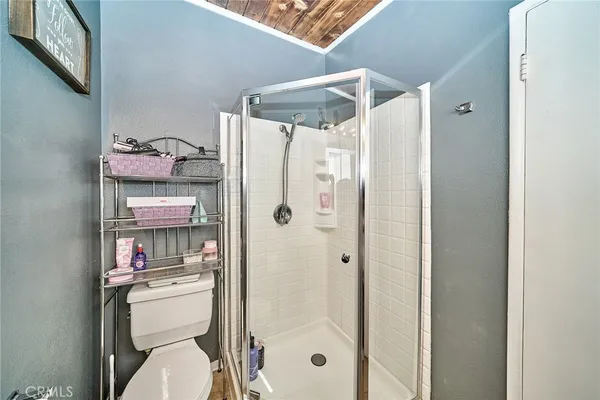 a bathroom with a shower curtain and a sink