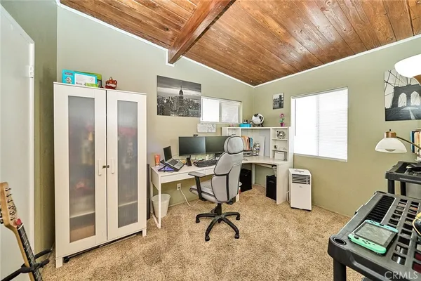 a view of a workspace with furniture