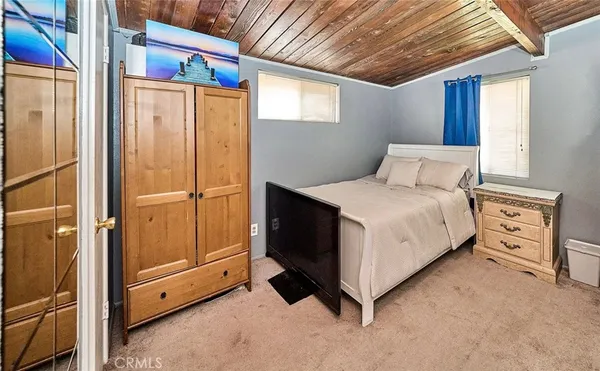 a bed room with a bed and a window