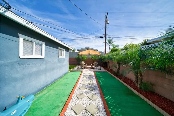 a view of a backyard with potted plants