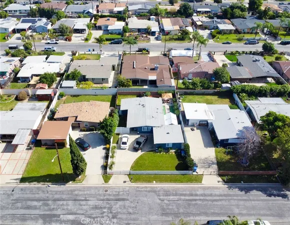 a view of multiple houses with yard