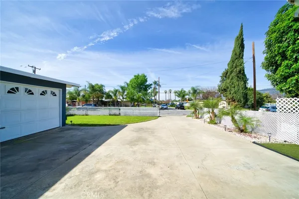 a view of a swimming pool and a yard