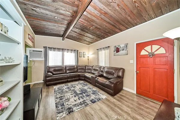 a living room with furniture or couch and a window