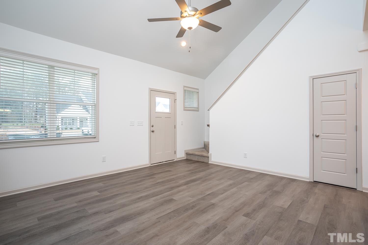 749 Hadstock Path Zebulon, NC 27597 - Photo 13 of 25 wooden floor in an empty room with a window