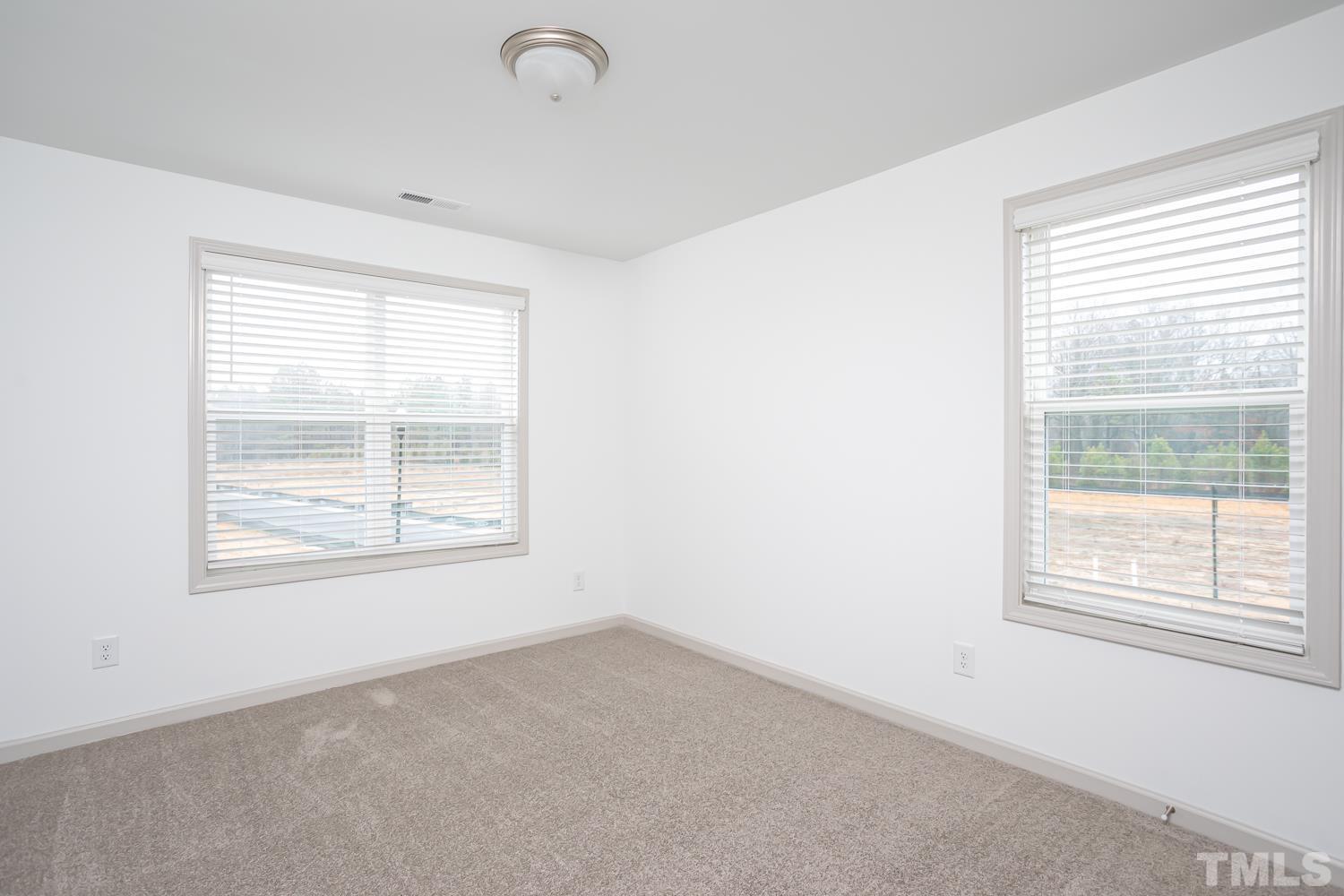 749 Hadstock Path Zebulon, NC 27597 - Photo 20 of 25 an empty room with a window