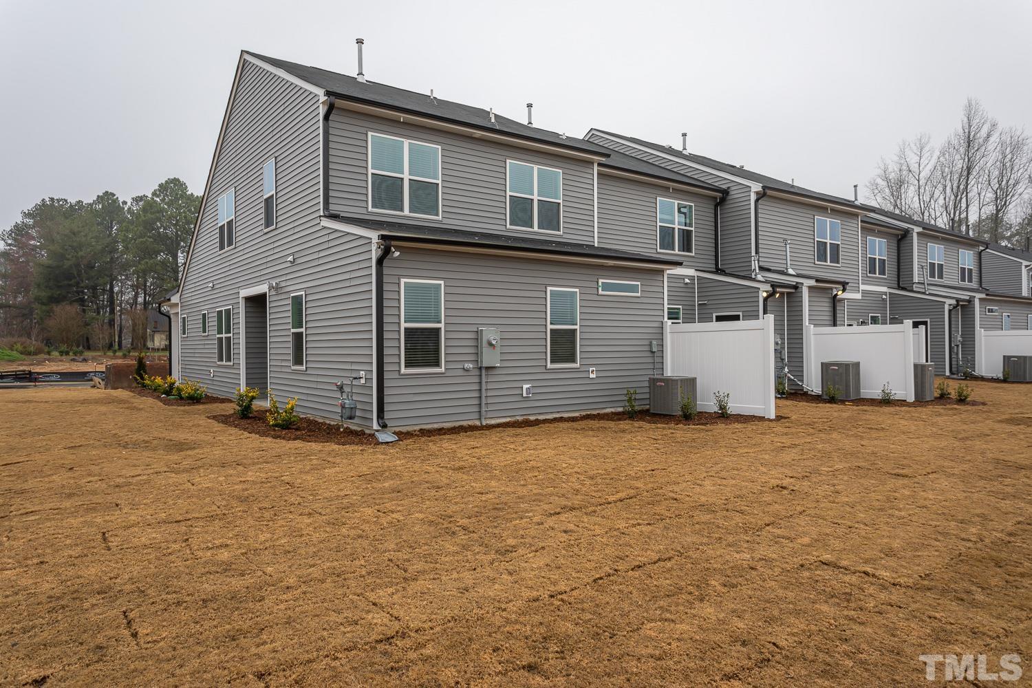 749 Hadstock Path Zebulon, NC 27597 - Photo 24 of 25 a front view of a house with windows