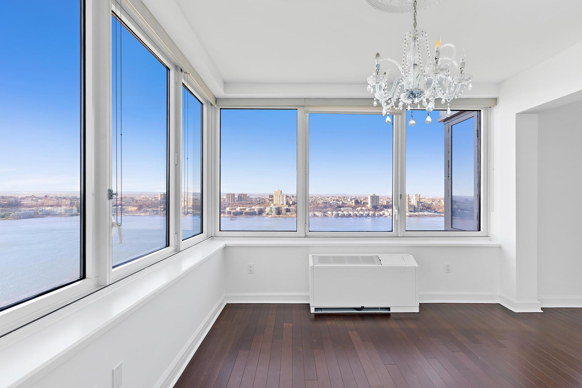 80 Riverside Boulevard, Unit 37B Manhattan, NY 10069 - Photo 16 of 22 a view of a livingroom with a furniture window and wooden floor
