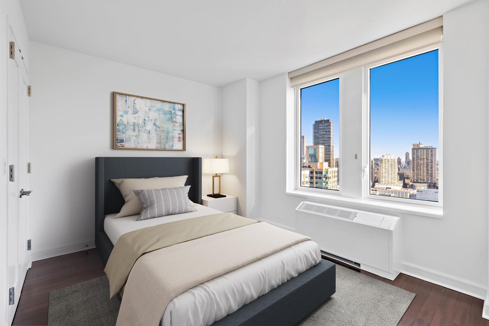 80 Riverside Boulevard, Unit 37B Manhattan, NY 10069 - Photo 2 of 22 a bedroom with a bed and a window