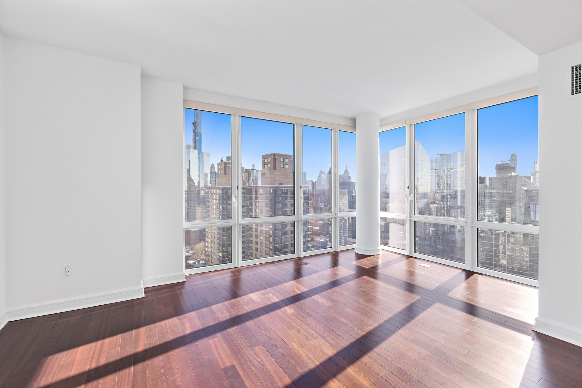 80 Riverside Boulevard, Unit 37B Manhattan, NY 10069 - Photo 5 of 22 a view of room with window and wooden floor