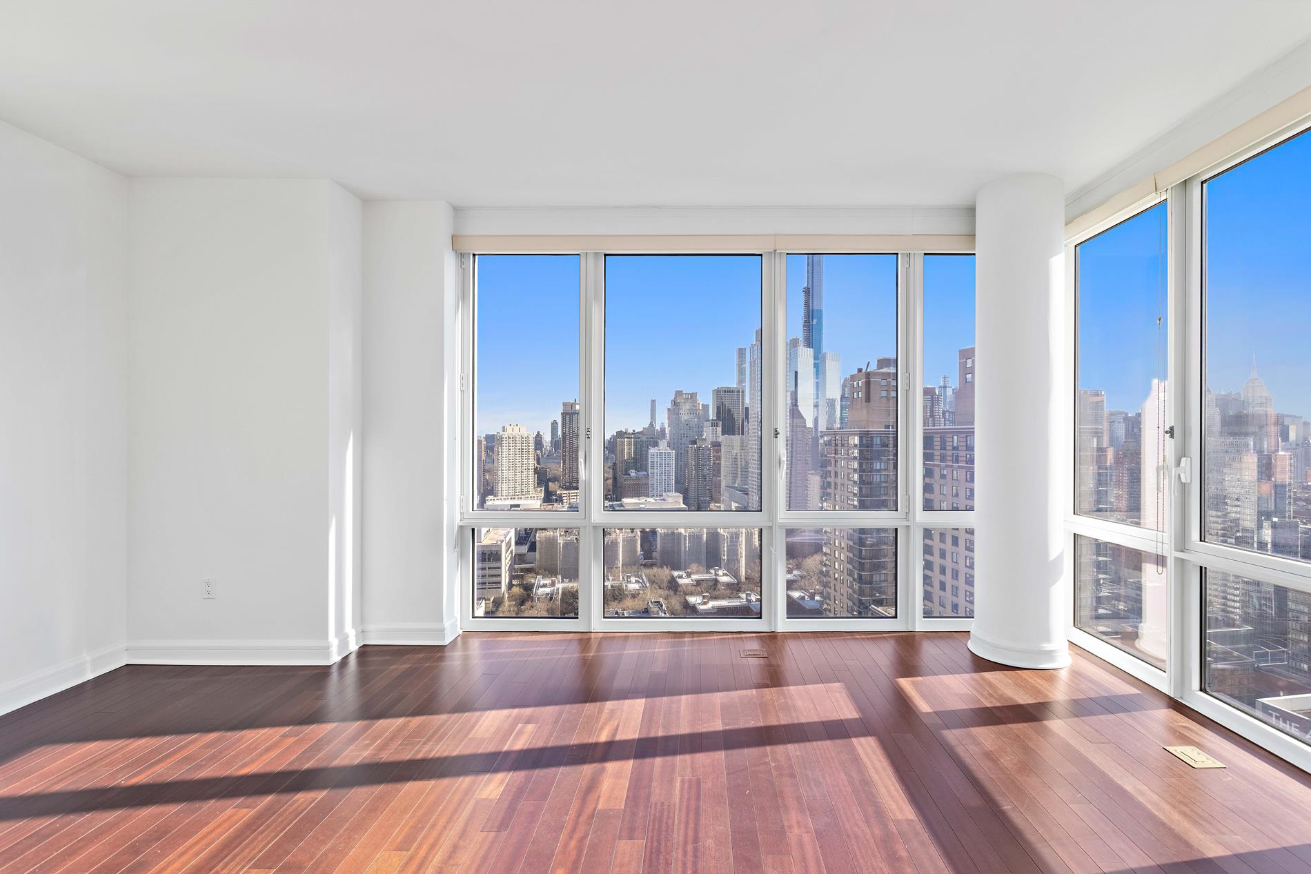 80 Riverside Boulevard, Unit 37B Manhattan, NY 10069 - Photo 6 of 22 a view of a living room with furniture and wooden floor