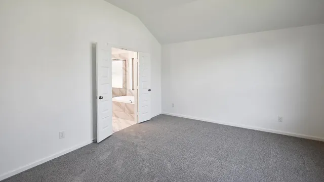a spacious bathroom with a tub sink and mirror