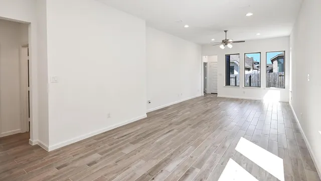 an empty room with wooden floor