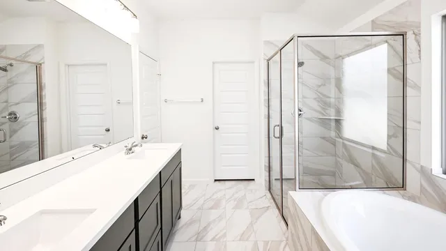 a spacious bathroom with a tub shower and sink