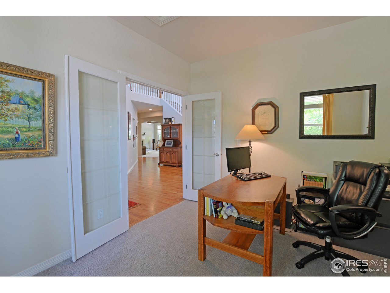 8113 Northstar Drive Windsor, CO 80528 - Photo 13 of 40 a living room with furniture and a table