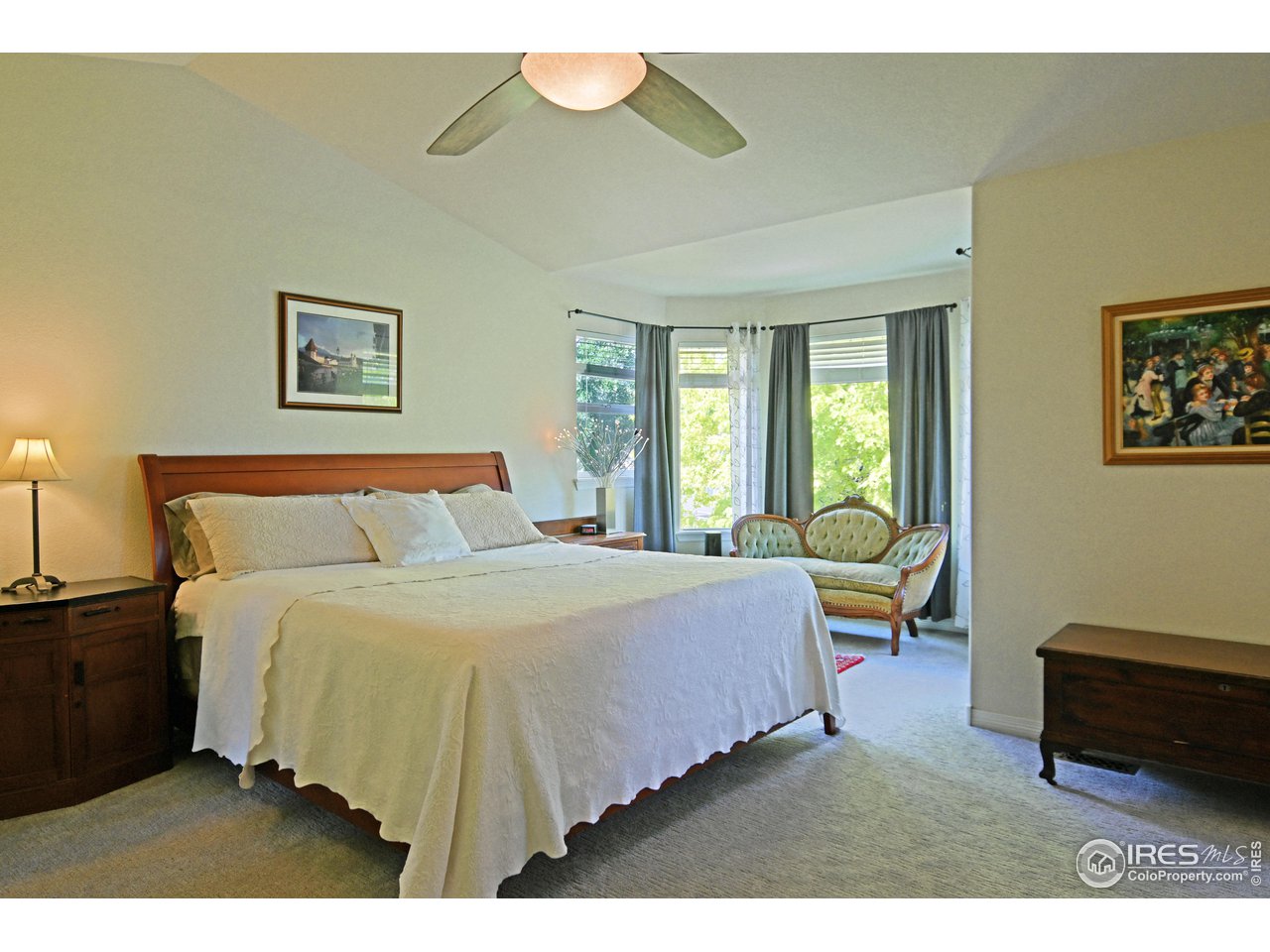 8113 Northstar Drive Windsor, CO 80528 - Photo 18 of 40 a bedroom with a bed lamp and a potted plant