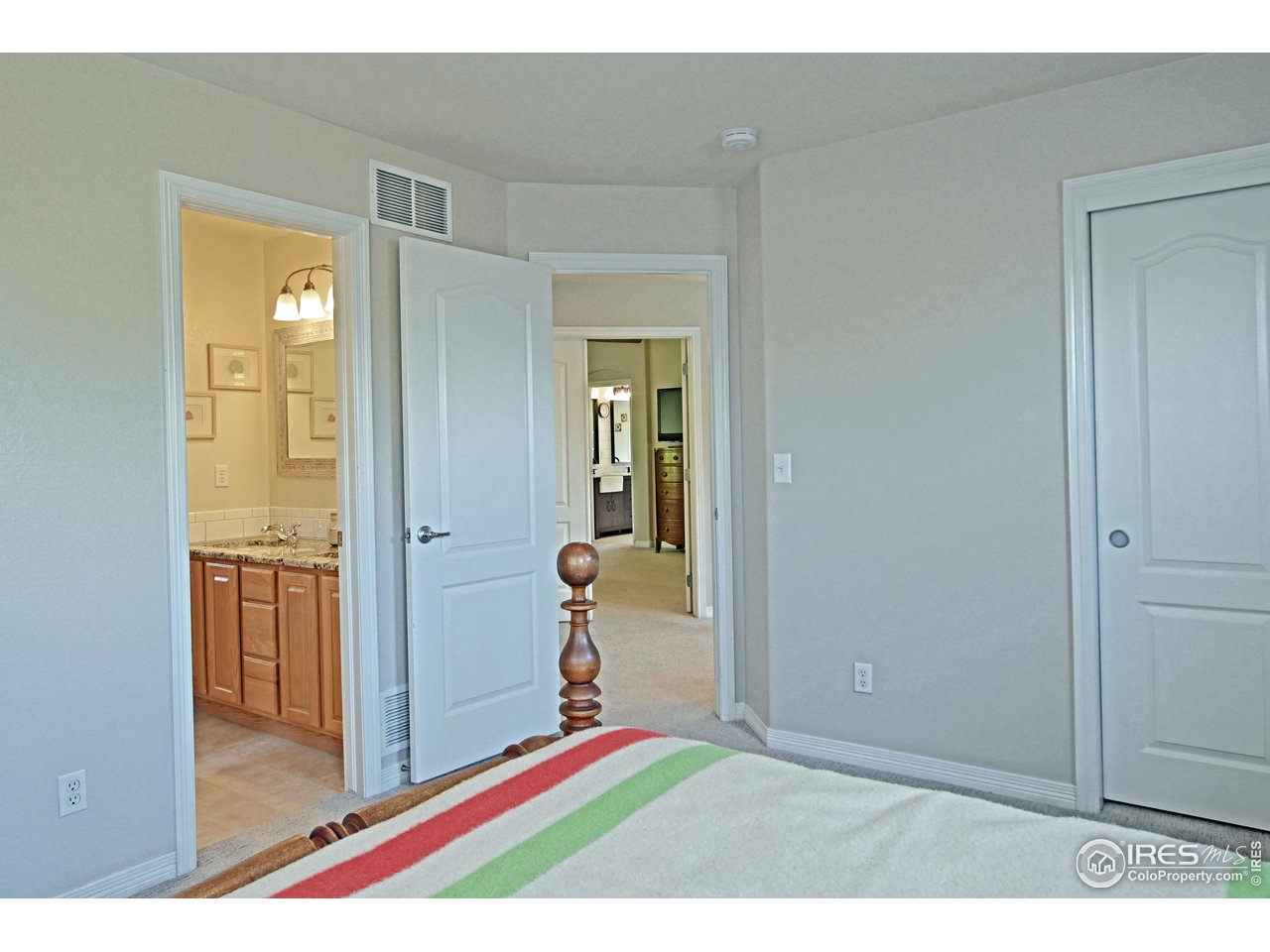 8113 Northstar Drive Windsor, CO 80528 - Photo 25 of 40 a view of a bedroom from the hallway