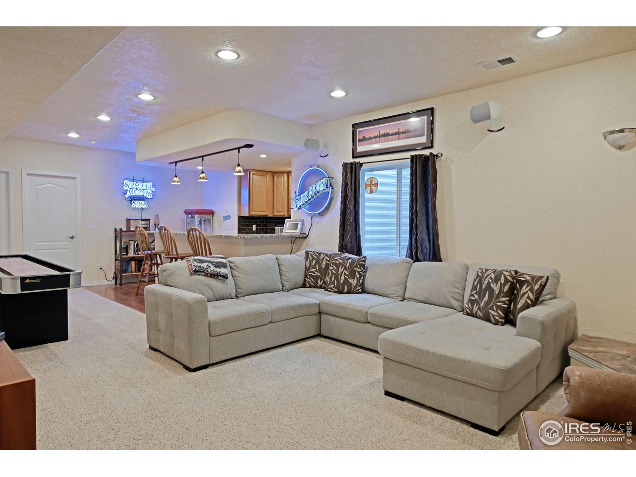 8113 Northstar Drive Windsor, CO 80528 - Photo 27 of 40 a living room with furniture and a fireplace