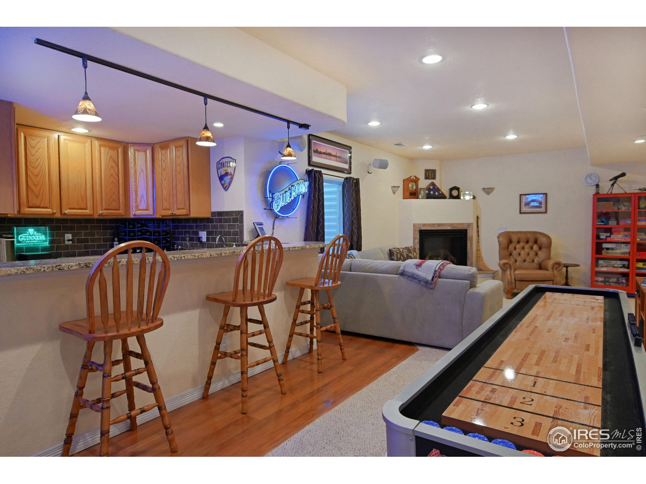 8113 Northstar Drive Windsor, CO 80528 - Photo 29 of 40 a living room with furniture and a flat screen tv