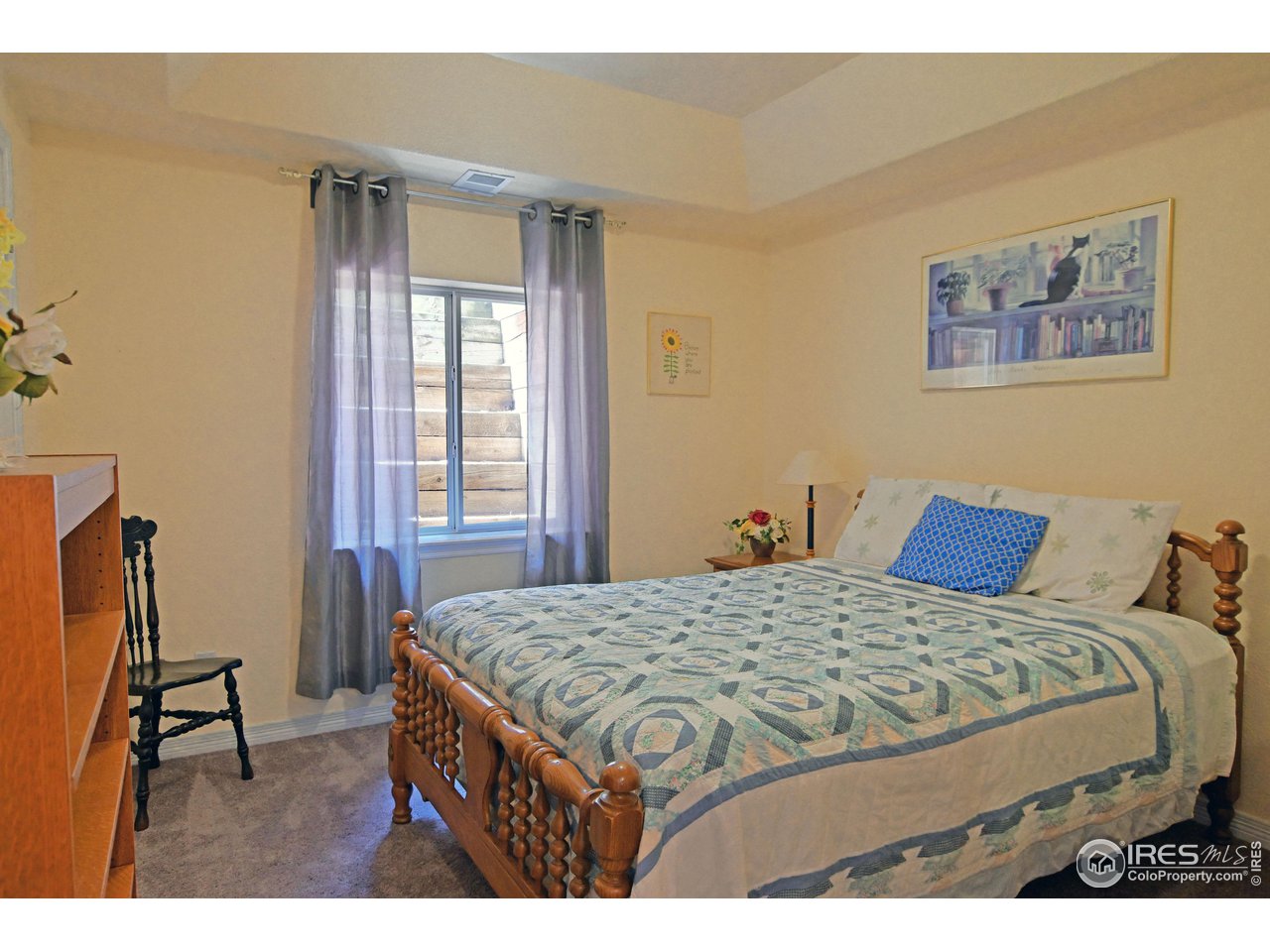 8113 Northstar Drive Windsor, CO 80528 - Photo 30 of 40 a bedroom with a bed a desk and chair