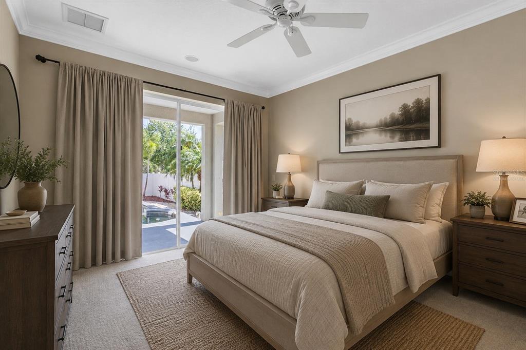 10121 Porch Street New Port Richey, FL 34655 - Photo 22 of 57 a bedroom with a large bed and a chandelier